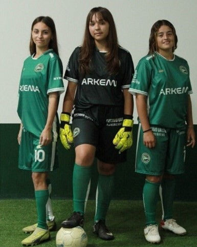 Girls playing football